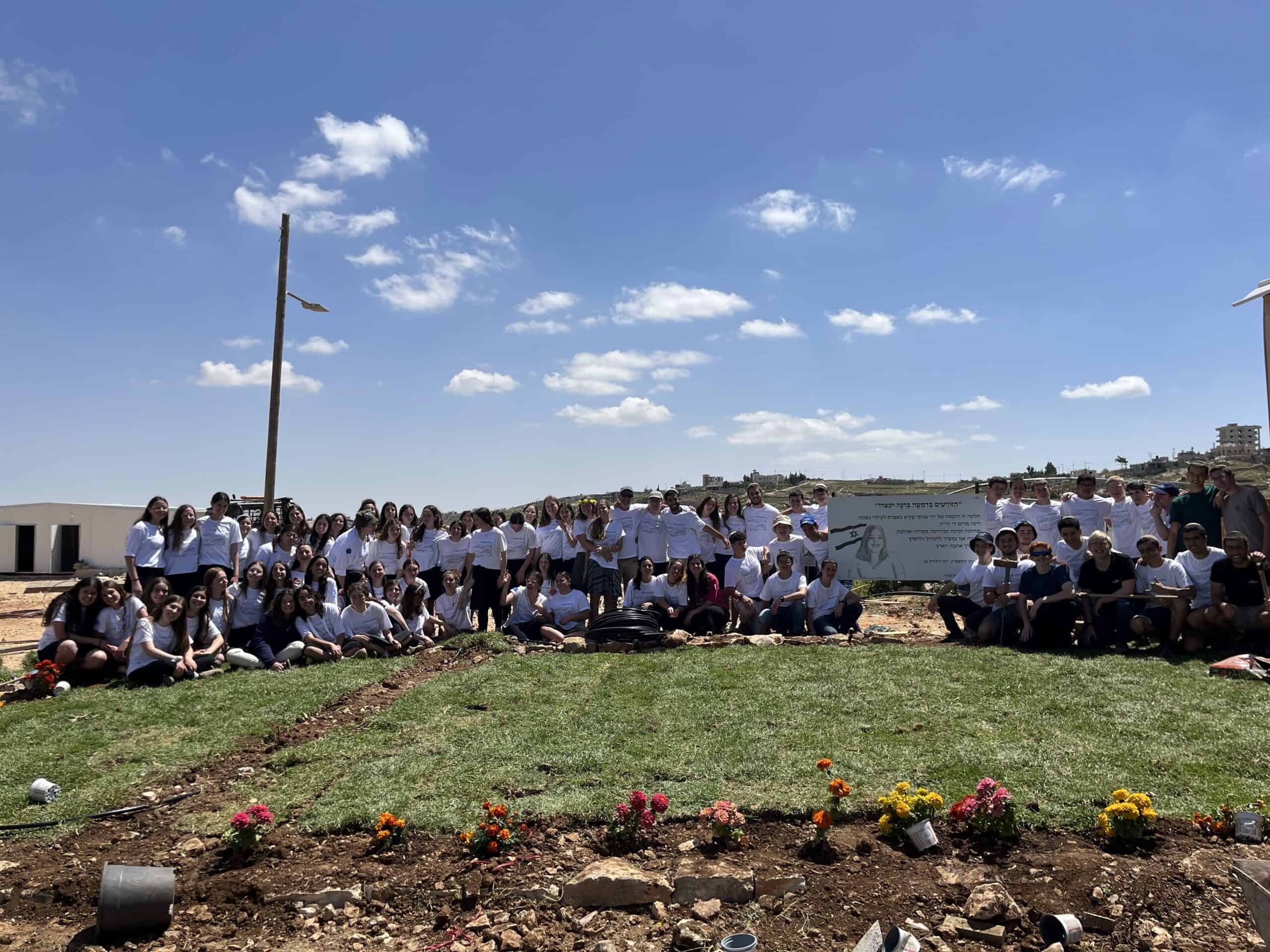 Youth group planting trees at Efrat Development Foundation community event.